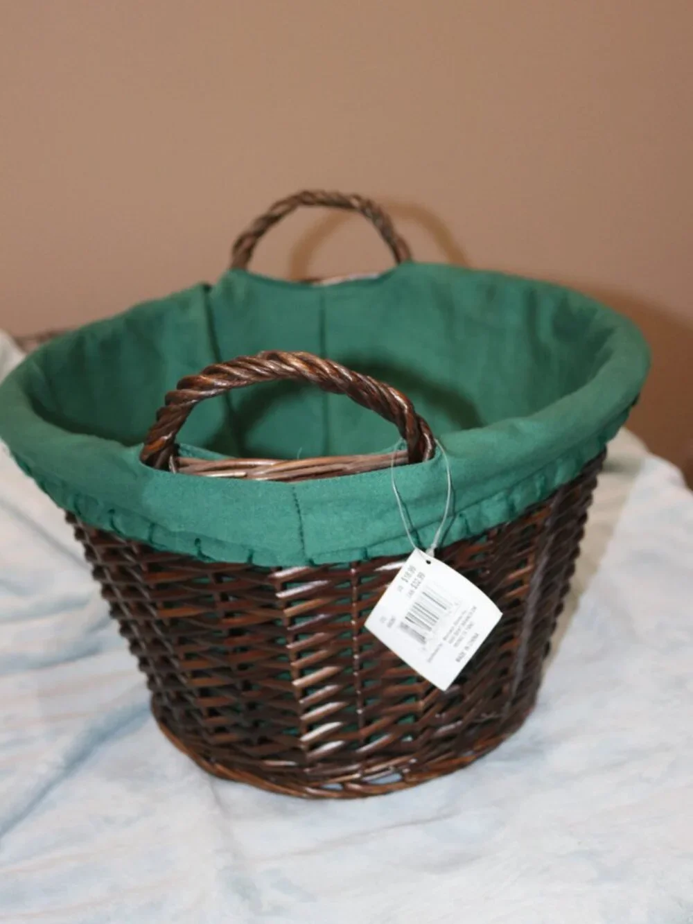 Dark brown circular handle basket with lining.